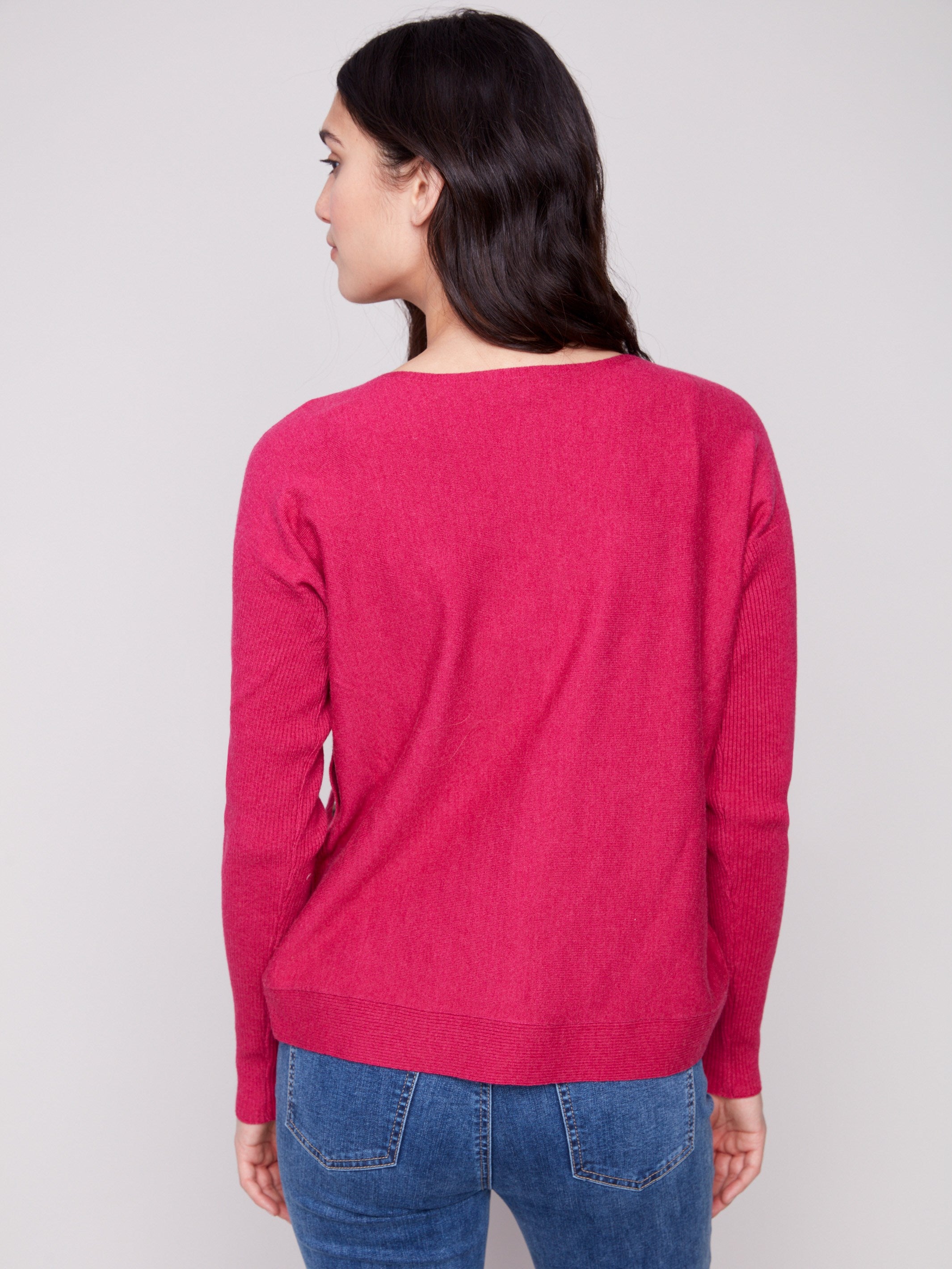 Stylish long-sleeve boat neck sweater in heather hibiscus with unique side button details for a chic look by Charlie B.