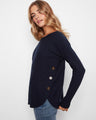 Navy sweater with a stylish boat neck and ribbed sleeves, perfect for casual outings. Designed by Charlie B.