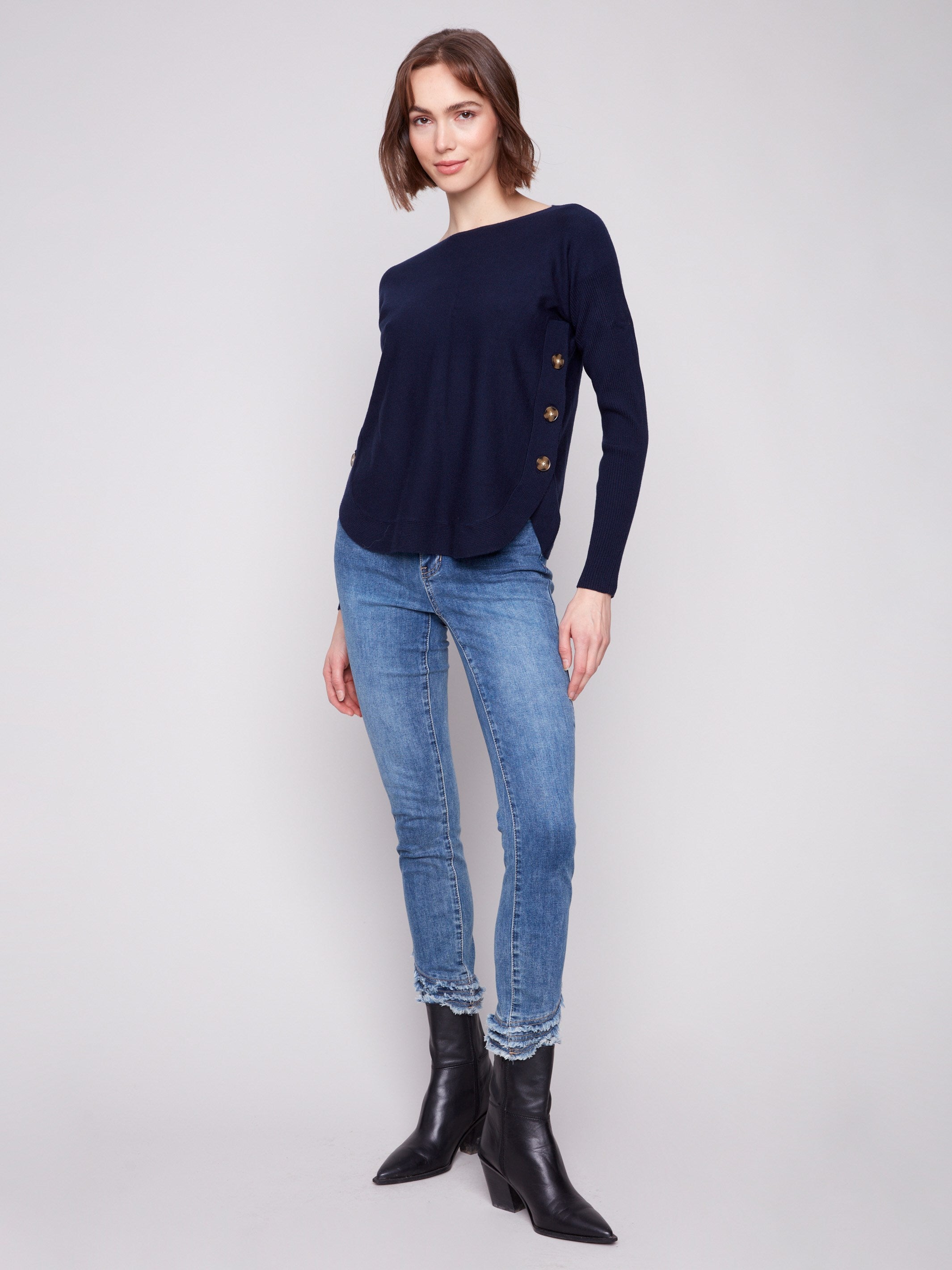 Chic navy sweater featuring side button details, perfect for both casual and formal settings by Charlie B.