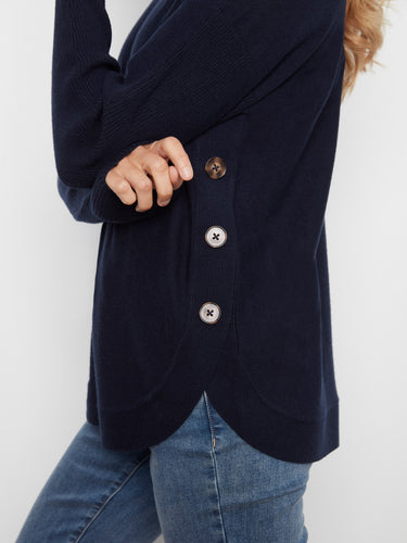 Elegant navy sweater showcasing unique side button details, adding charm to your look. By Charlie B.