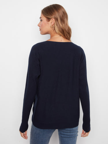 Stylish navy pullover with ribbed sleeves, offering both comfort and style in one piece. Crafted by Charlie B.