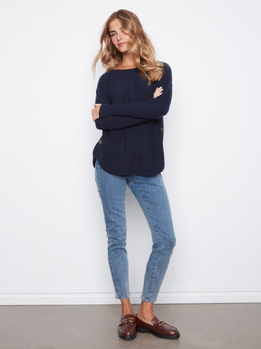 Navy top designed with a flattering boat neck, ideal for any wardrobe collection. Created by Charlie B.