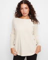 Cream sweater featuring a stylish boat neck and rounded hem, perfect for a casual yet chic look by Charlie B.