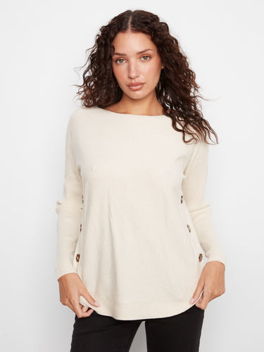 Cream sweater featuring a stylish boat neck and rounded hem, perfect for a casual yet chic look by Charlie B.