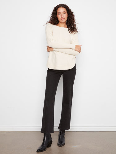 Sophisticated cream sweater designed with ribbed sleeves for added texture and style by Charlie B.