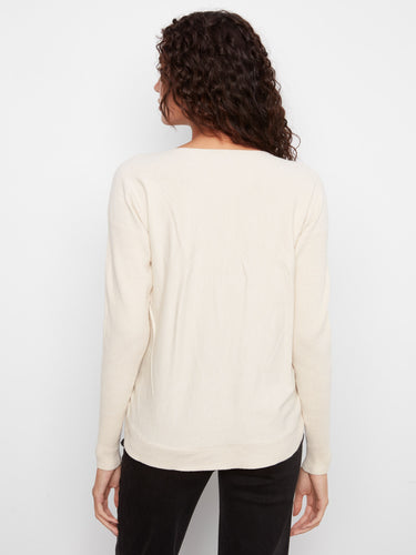 Cream sweater offering comfort with its unique boat neck design, perfect for any occasion by Charlie B.