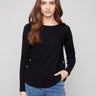 Elegant black sweater featuring a boat neck design, ideal for versatile styling by Charlie B.
