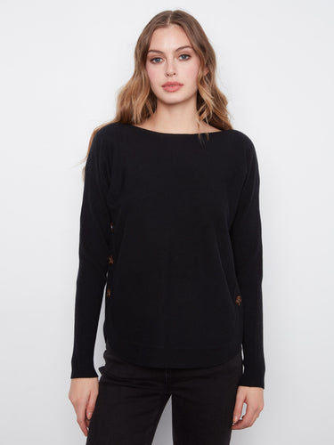 Black long-sleeve sweater with ribbed sleeves and side button detail by Charlie B.