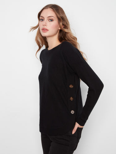 Sweater in black featuring a rounded hem and side button detail by Charlie B.