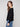 Black long-sleeve sweater showcasing ribbed sleeves for added texture by Charlie B.