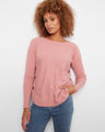 Soft pink sweater with a rounded hem, featuring ribbed sleeves for added texture by Charlie B.