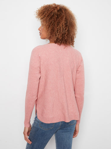 Versatile pink knit with a rounded hem and elegant ribbed sleeves for a sophisticated look by Charlie B.