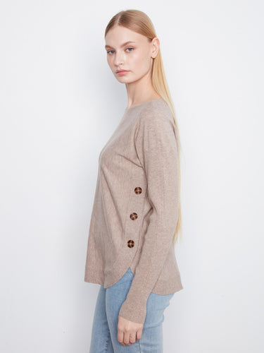 Chic sweater with side button details, offering a unique touch to a classic piece by Charlie B.