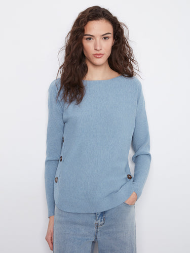Elegant light blue sweater with ribbed sleeves, rounded hem, and distinctive side button details. By Charlie B.
