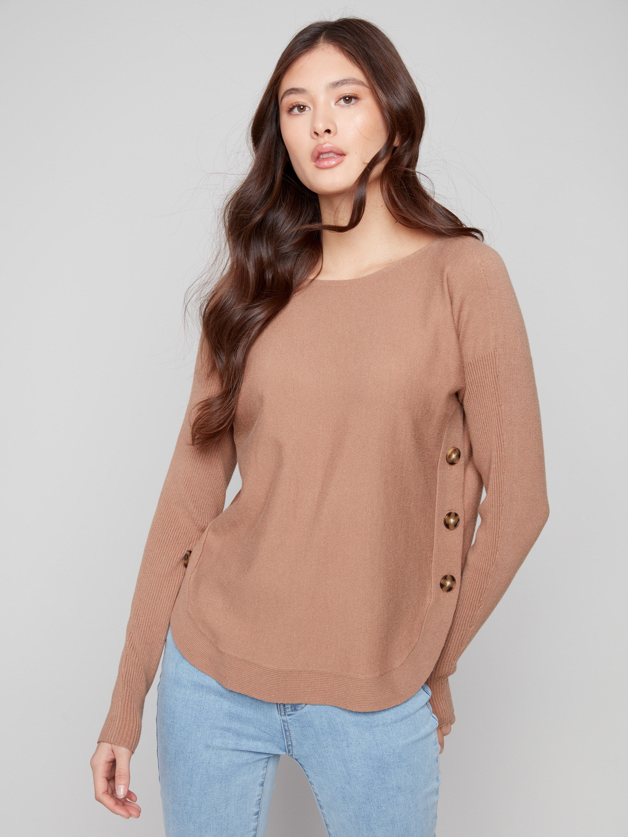 Sophisticated truffle sweater with ribbed sleeves and side button accents for versatile styling by Charlie B.