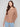Sophisticated truffle sweater with ribbed sleeves and side button accents for versatile styling by Charlie B.