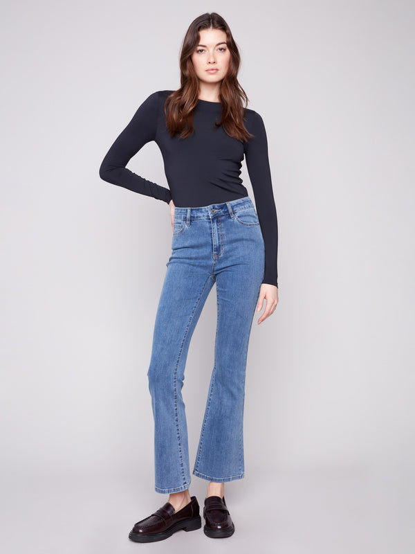 These jeans feature a bootcut fit, perfect for pairing with your favorite shoes by Charlie B.