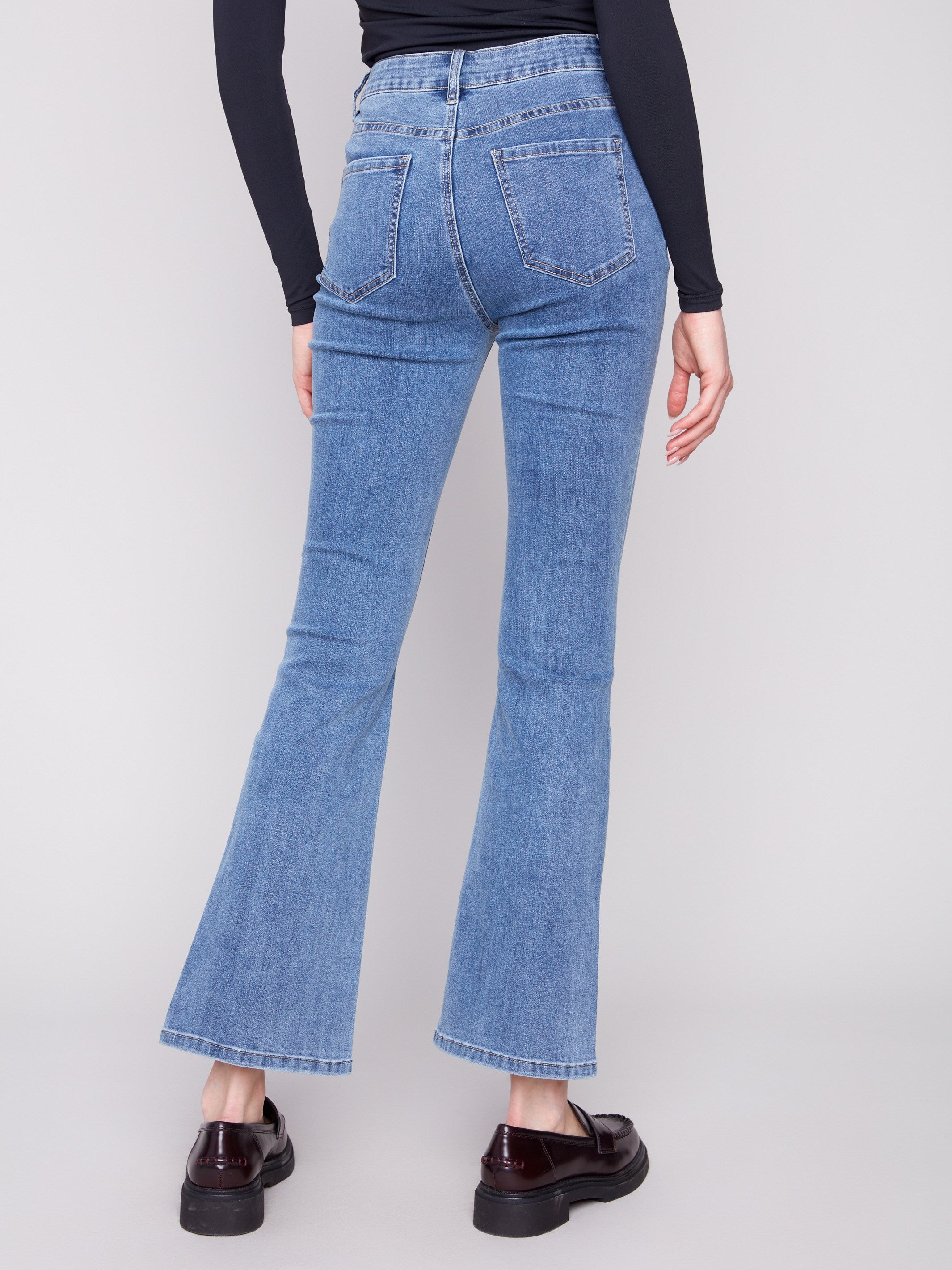 Designed with long length, these jeans provide an elongated silhouette by Charlie B.