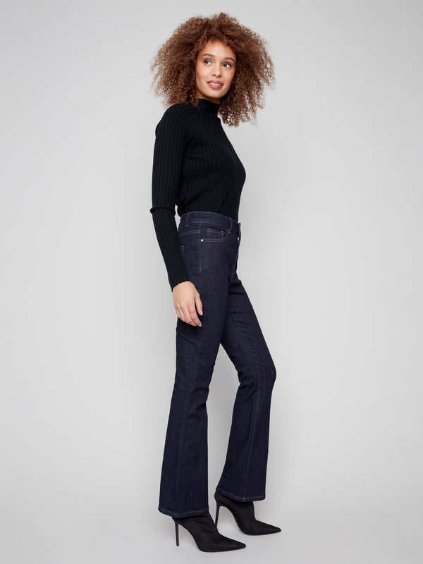Classic five-pocket design adds functionality to these chic deep blue jeans by Charlie B.