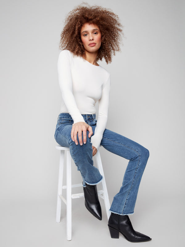 Long length bootcut jeans in medium blue, designed for a sleek silhouette by Charlie B.