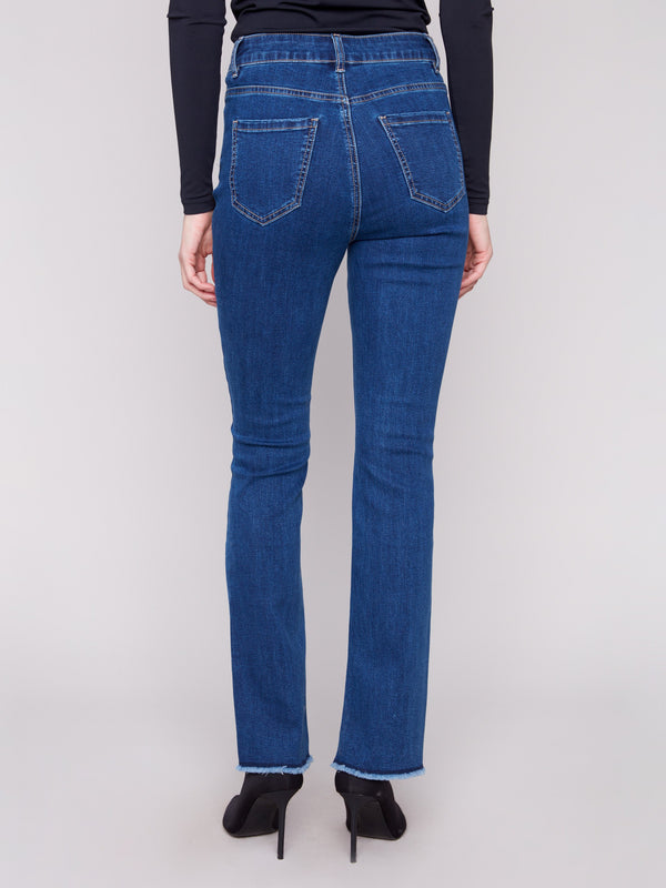 Chic bootcut jeans in indigo with comfortable stretch denim and an asymmetrical hem detail by Charlie B.