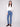 Medium blue bootcut denim pants by Charlie B featuring a stylish mid-rise waist, perfect for everyday wear.