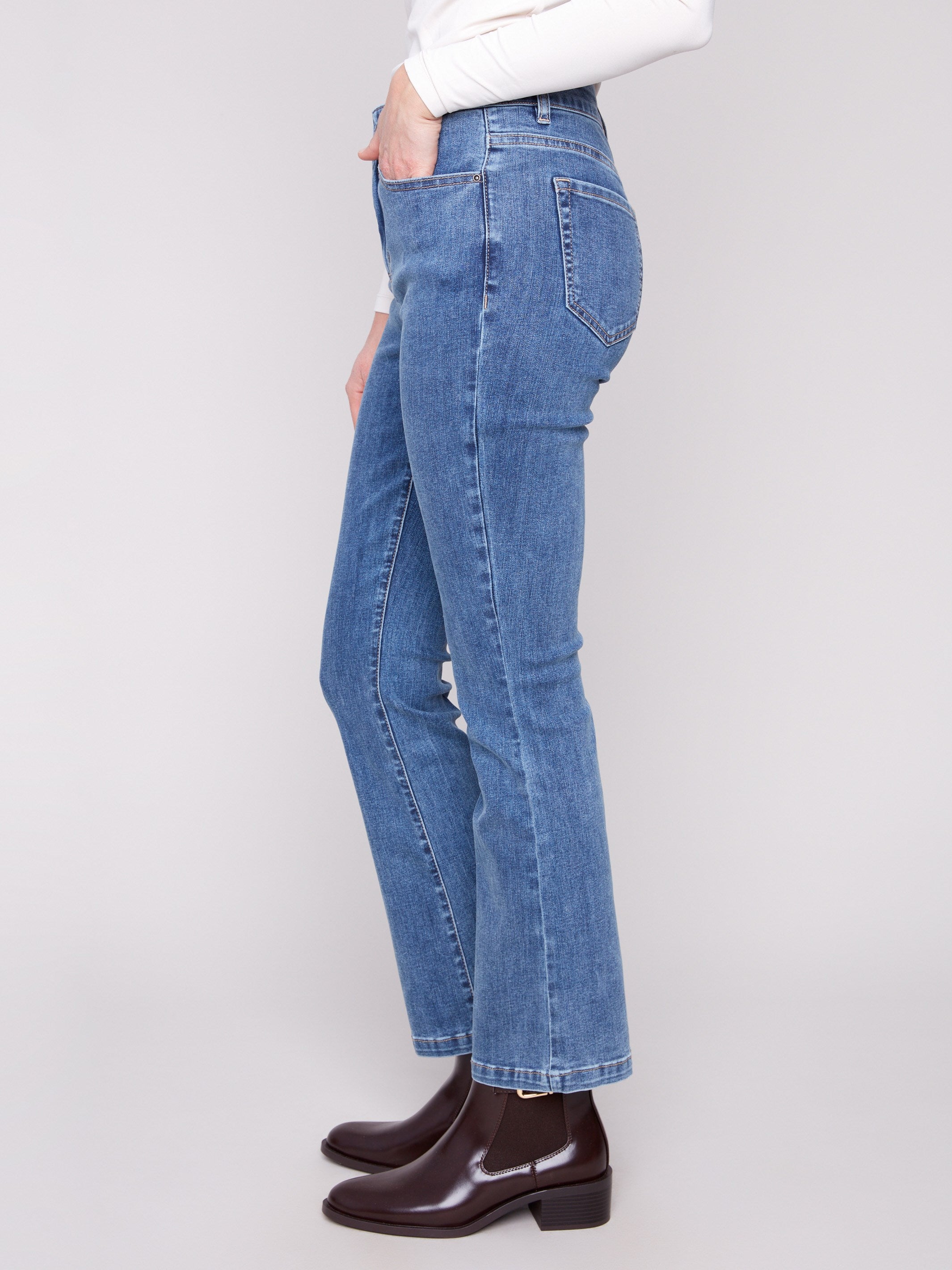 Stylish five-pocket design enhances the classic look of these medium blue bootcut jeans by Charlie B.