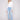 Light blue denim pants featuring a flattering bootcut fit and stylish design by Charlie B.