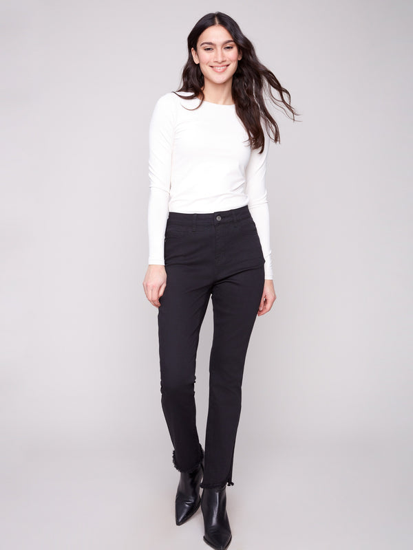 Black twill pants featuring a bootcut fit and regular rise, perfect for versatile styling by Charlie B.