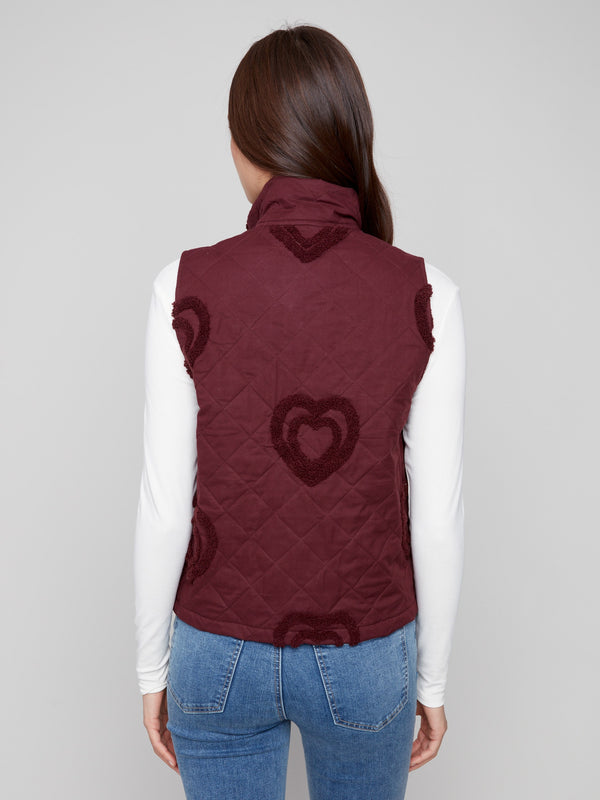 Stylish cabernet vest with welt pockets, offering functionality and flair to any outfit by Charlie B.