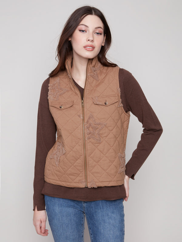 Khaki quilted vest with a sleek zip front closure, featuring stylish boucle star accents for a unique touch by Charlie B.