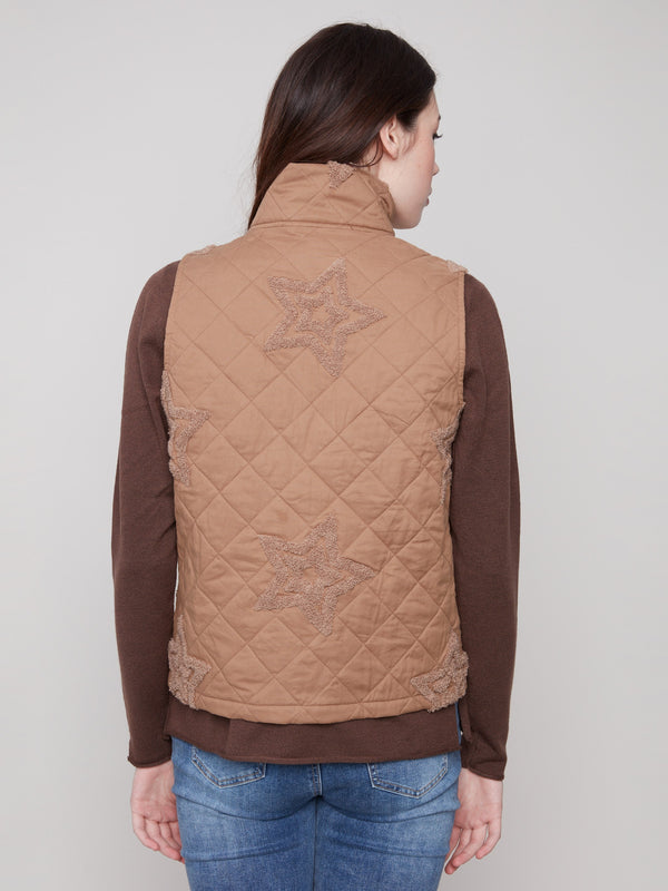Elegant quilted design with playful boucle star details, perfect for layering in cooler weather by Charlie B.