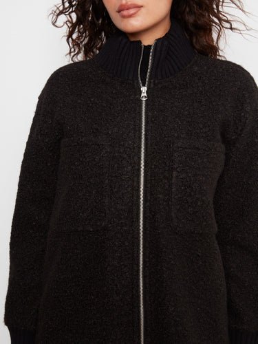 Featuring practical chest pockets, this coat combines style with utility seamlessly. By Charlie B.
