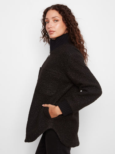 Side slash pockets provide additional storage without sacrificing the sleek design of the coat. By Charlie B.