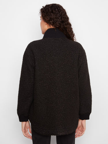 Ribbed cuffs complete the look, ensuring comfort and style in every wear of this elegant coat. By Charlie B.