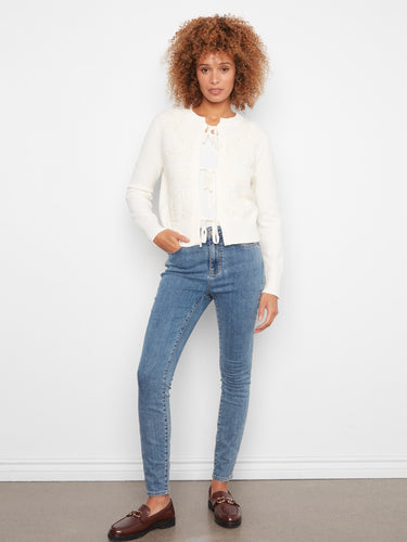 Adorned with ribbed cuffs and hem, this jacquard knit cardigan offers a chic yet comfortable fit by Charlie B.