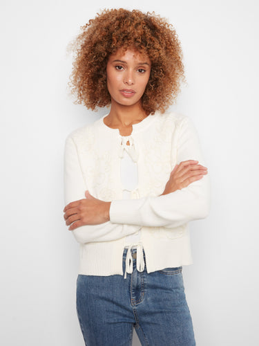Showcasing tie-front bows, this ecru cardigan combines style and functionality effortlessly by Charlie B.