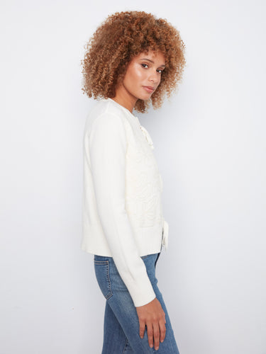 The intricate floral embroidery adds an elegant touch to the classic design of this cardigan by Charlie B.