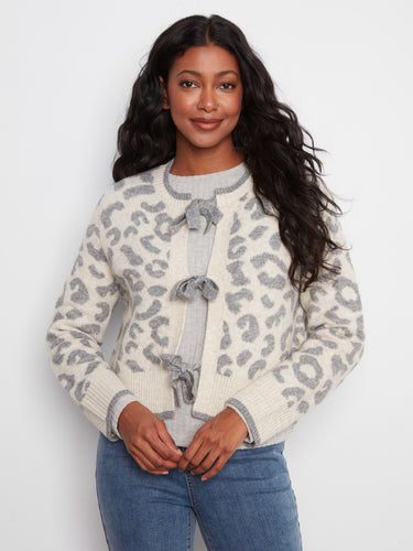 Stay cozy and stylish with this soft jacquard knit cardigan, designed to keep you warm while looking fabulous by Charlie B.