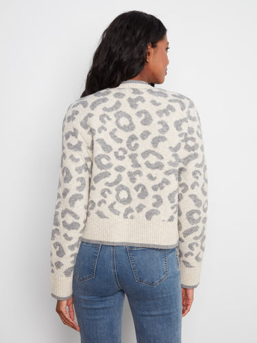 Elegant ribbed cuffs and hem detail this cardigan, offering a snug fit that complements your silhouette effortlessly by Charlie B.