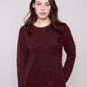 Cabernet sweater with a speckled pattern, showcasing long sleeves and a chic braided 'Love' detail on the front by Charlie B.
