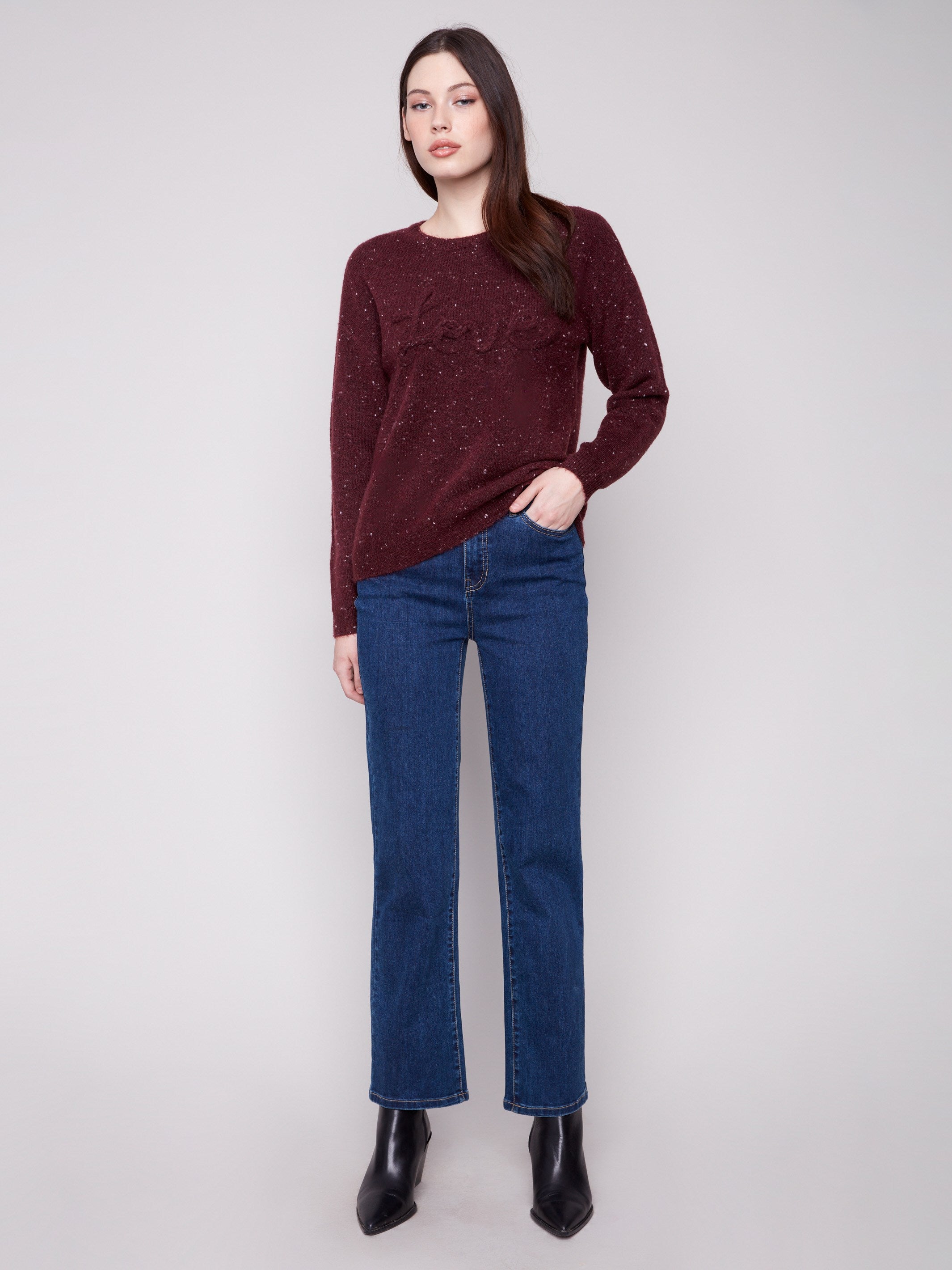 Chic cabernet sweater with drop shoulder design, highlighted by a charming speckled pattern and braided 'Love' detail on the front by Charlie B.