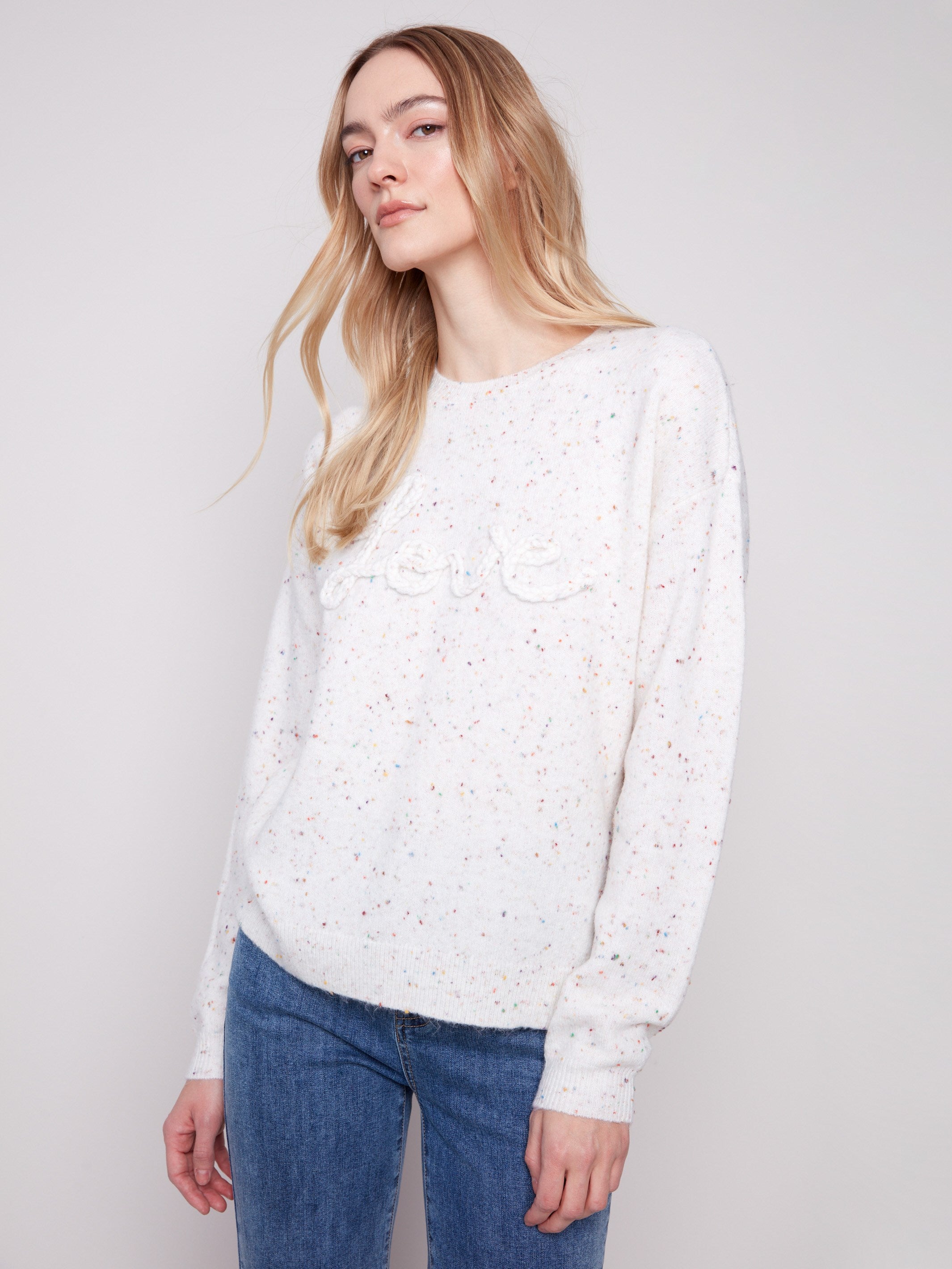 Chic ecru sweater featuring long sleeves and an eye-catching speckled pattern, ideal for casual wear by Charlie B.