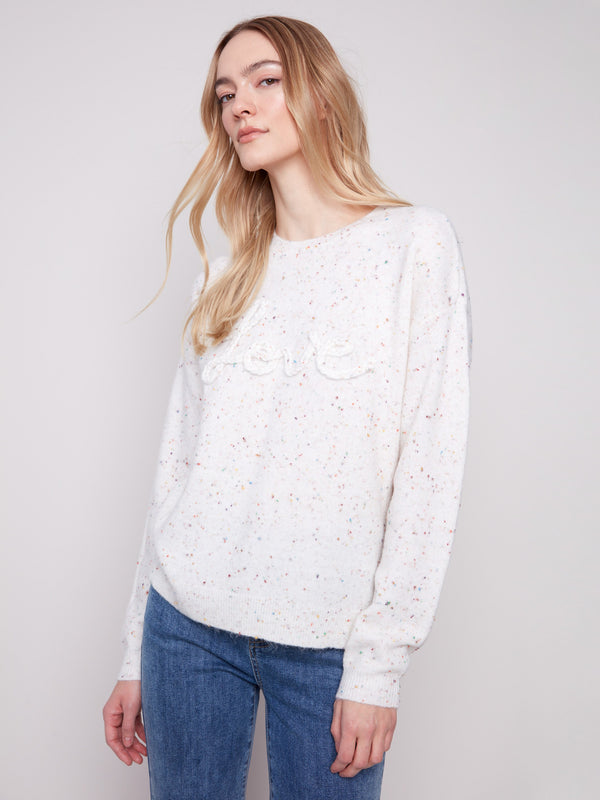 Chic ecru sweater featuring long sleeves and an eye-catching speckled pattern, ideal for casual wear by Charlie B.