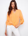 Orange top with a stylish front knot detail, enhancing its casual elegance. Made from 100% cotton for breathable comfort by Charlie B.