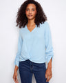 Light blue blouse with a stylish notch neckline and long roll-up sleeves, crafted from 100% cotton for comfort by Charlie B.