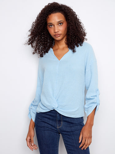 Elegant blouse in soft blue with long roll-up sleeves, designed for easy wear and crafted from pure cotton by Charlie B.
