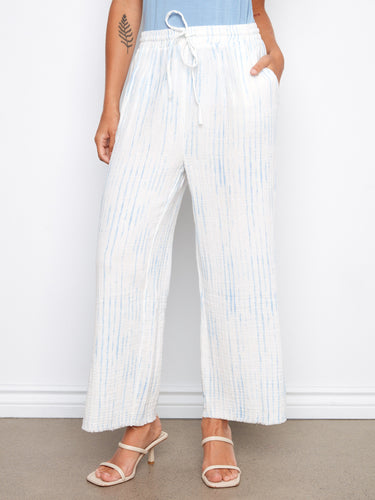 These stylish white and blue striped pants feature side slits, enhancing the airy design by Charlie B.