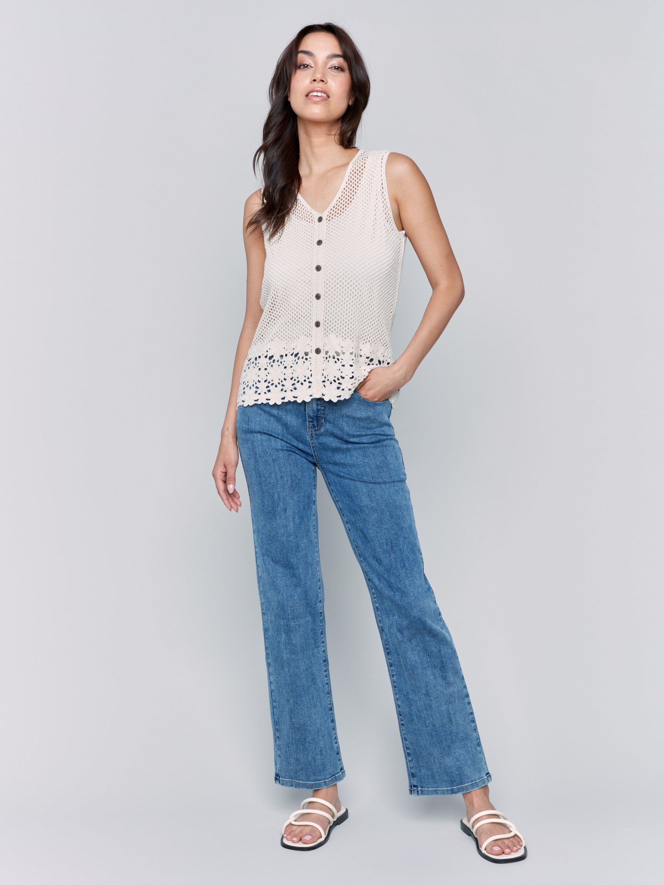 Sleeveless crochet vest featuring a floral hem by Charlie B.