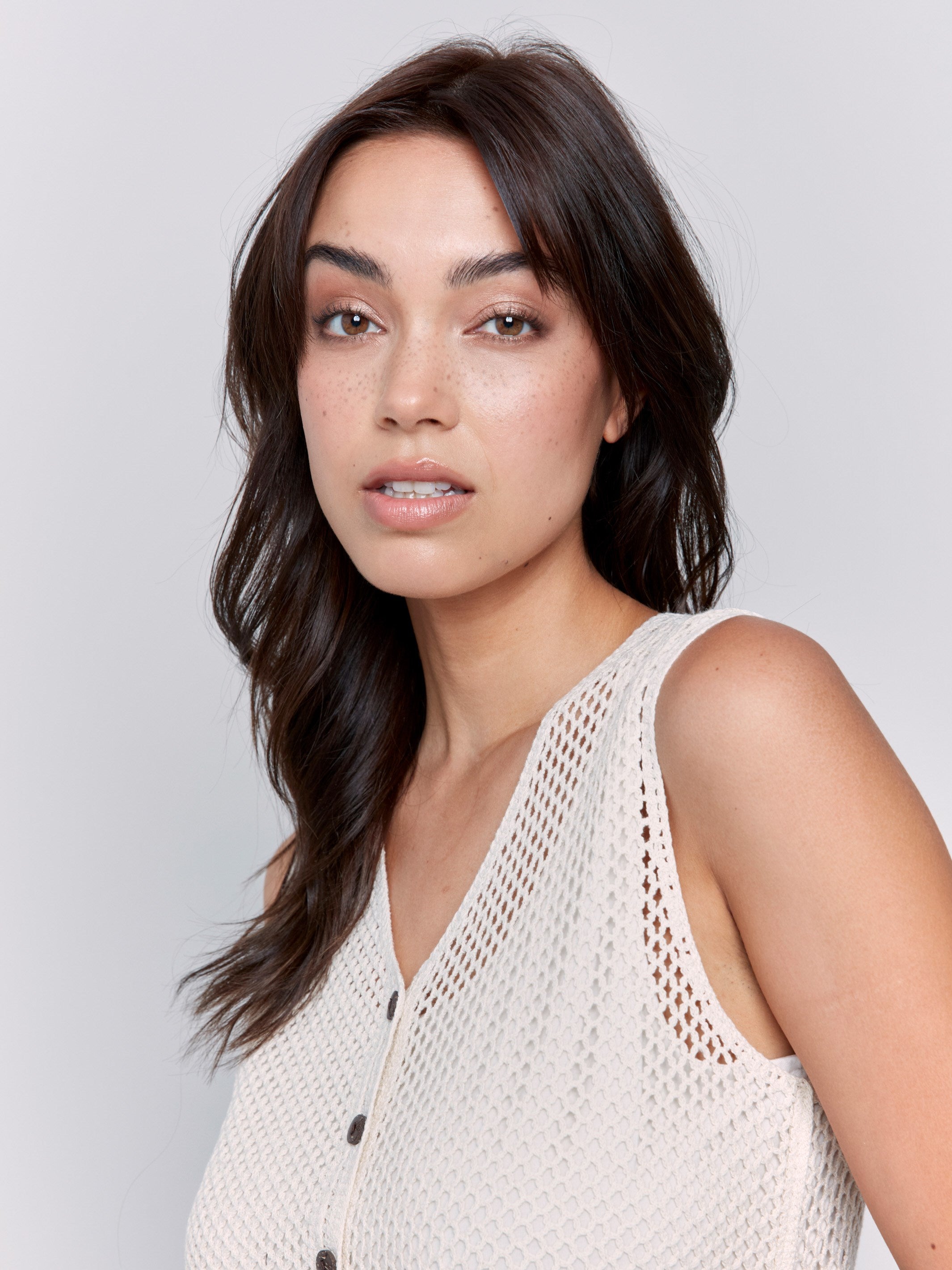 Crochet vest showcasing a delicate floral border by Charlie B.